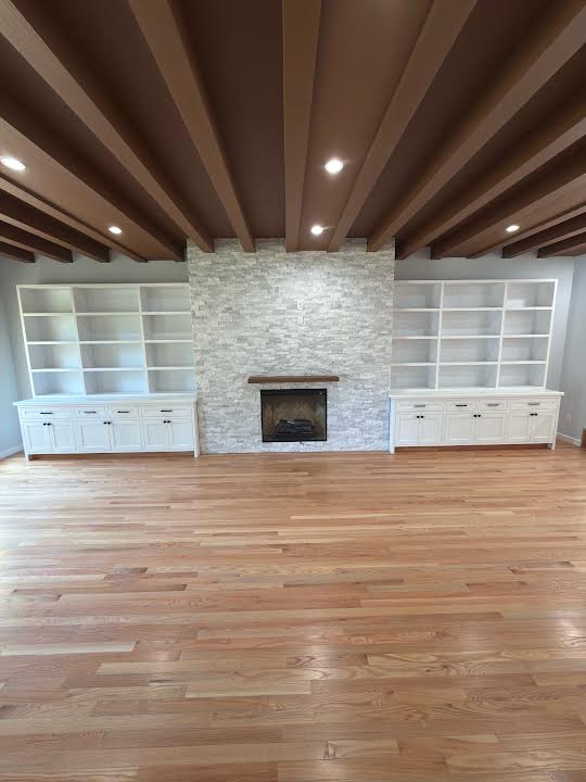Completed ORCCI fireplace wall and built-in shelving finish work in a Los Angeles living room